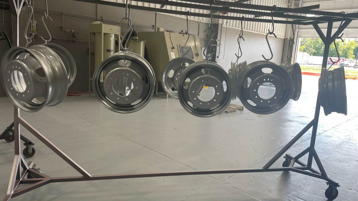 Wheel hubs hanging on the coating rack