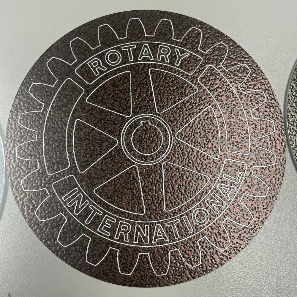 Engraved disc finished in a textured coat