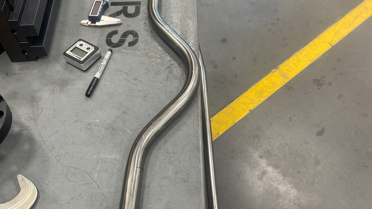 Bent tube beside the bender