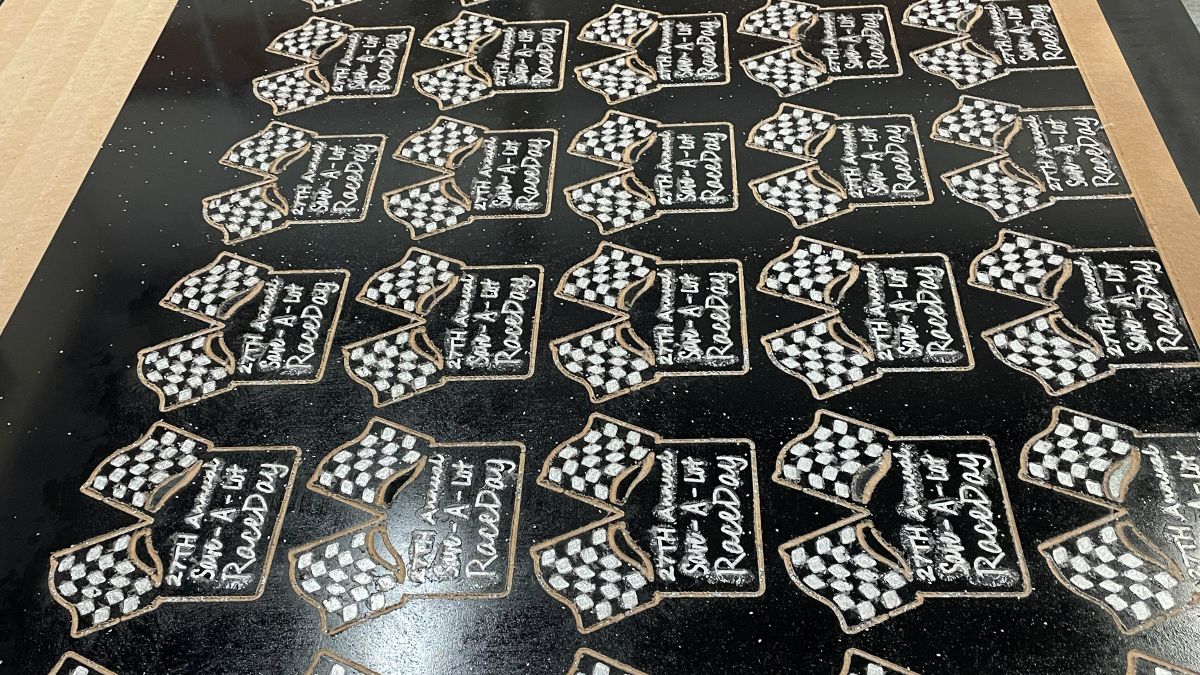 A run of CNC cut and coated plaques