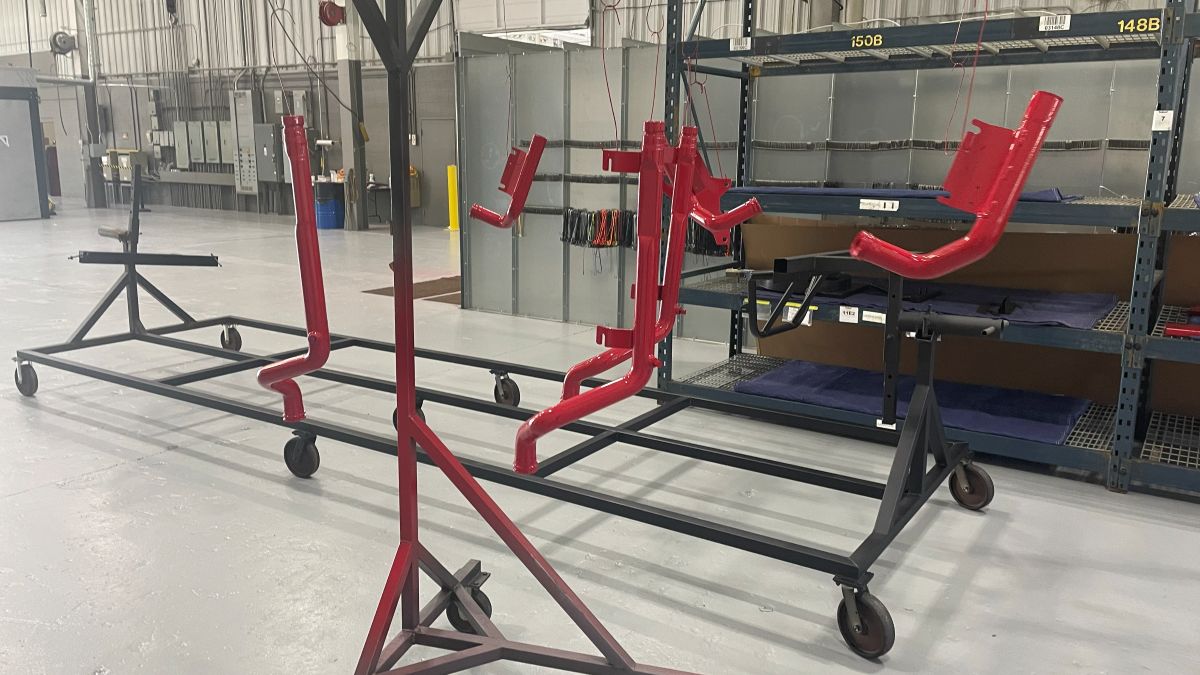 Parts finished in red on the rack