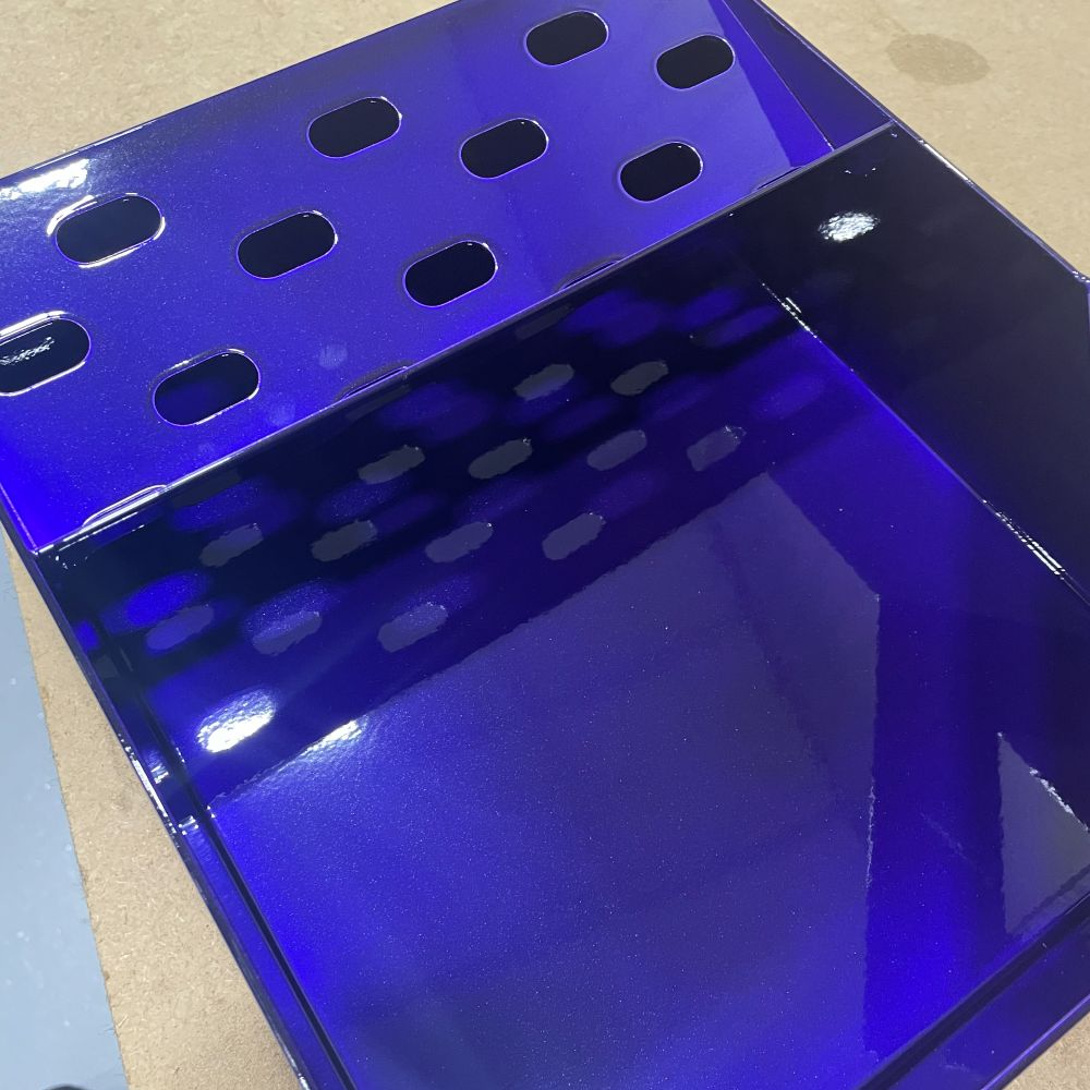 Sheet metal box in a translucent blue coat