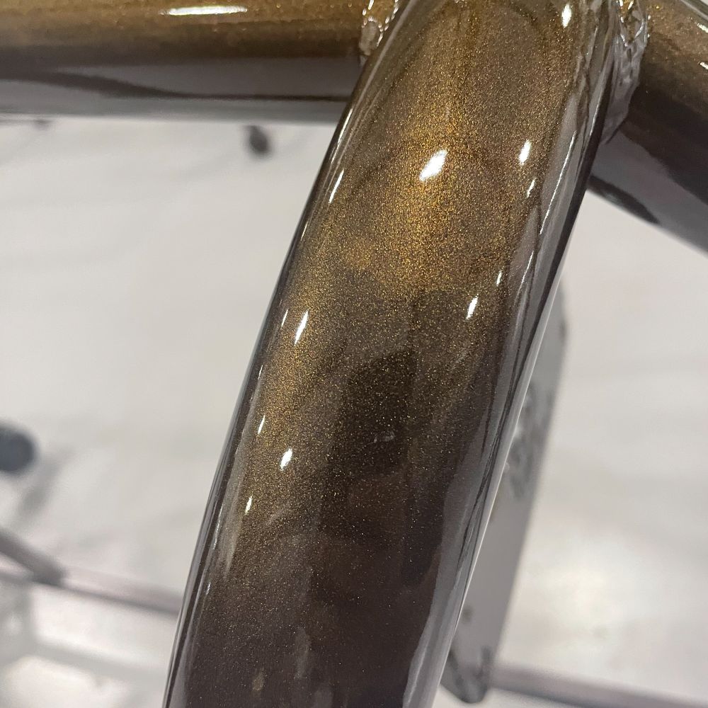 Close-up of a bronze metallic coat on tube