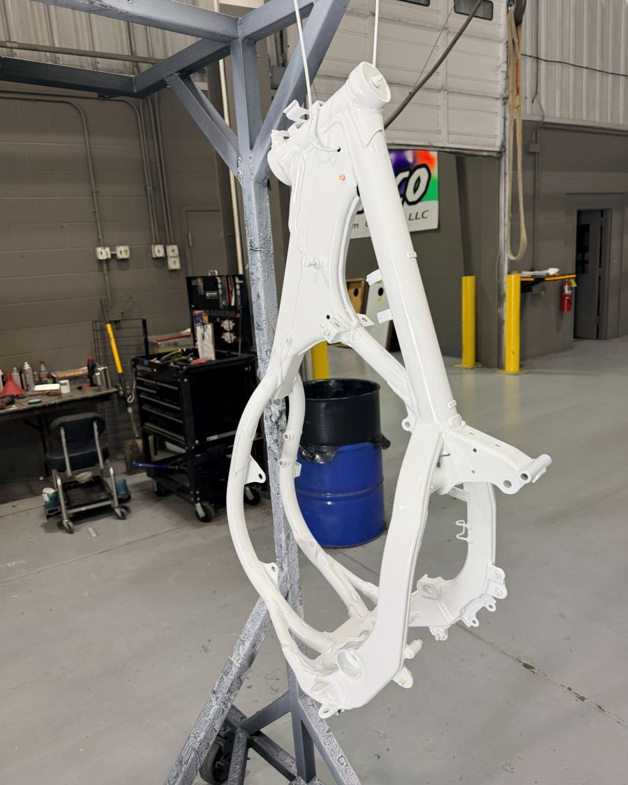 A freshly coated frame hanging on the line