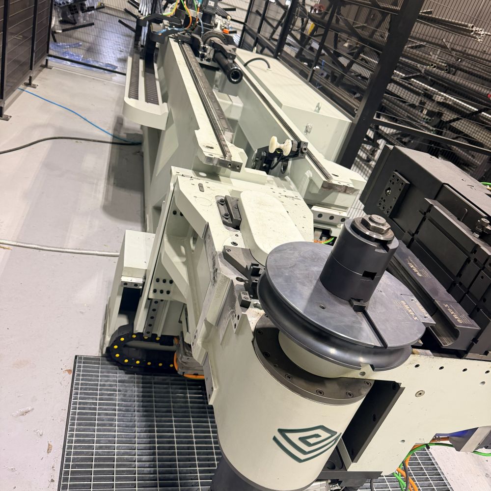 The CNC tube bender mid-bend