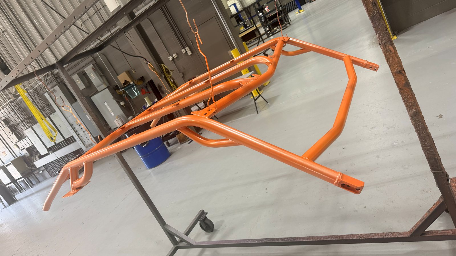 Race chassis in a purple powder coat, motorsports being one of the industries served
